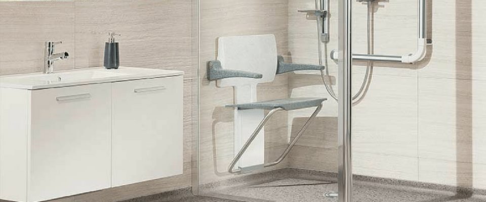A barrier-free bathroom with a roll-in shower and grab bars