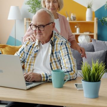 A man relaxing at his dining table at home