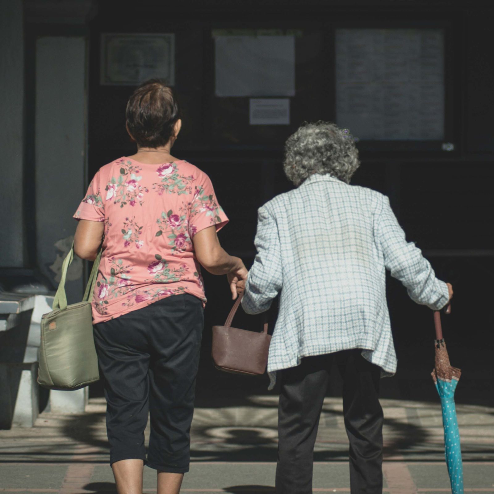 An older adult walking comfortably at home