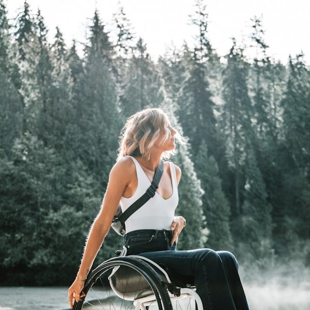 A woman moving confidently through her accessible home in a wheelchair